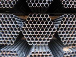 MS pipes stacked in warehouse for construction and industrial applications